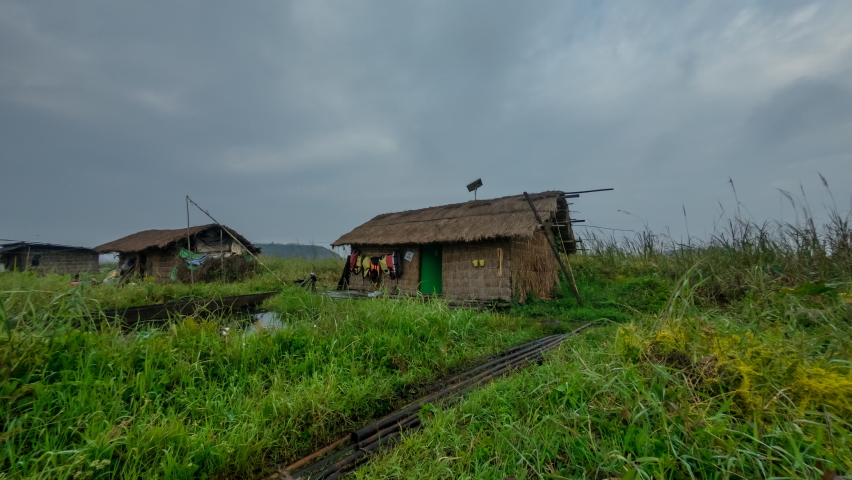 Timelapse of Clouds Moving Over Wooden House at Loktak Lake, Manipur, India