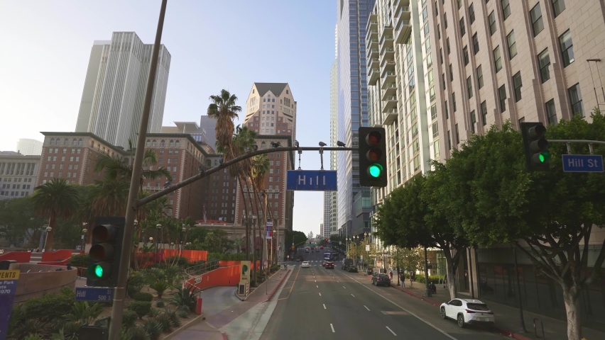 
LOS ANGELES, CA, USA - March 15, 2022: Drone view of Los Angeles street, cars, modern office buildings, skyscrapers, banks, downtown apartments in LA. Urban life, city in USA.