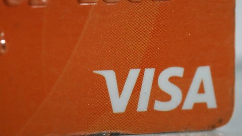 Istanbul-Turkey - 03 27 2022: Macro close up shot of VISA Credit debit cart. Plastic business card for payement, finance concept