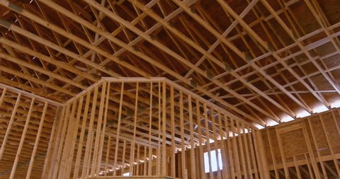Wooden roof trusses framework on stick built home the under construction framing an interior view