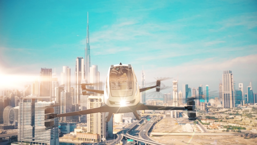 Front view of autopilot taxi drone flying above futuristic city. Aerial view of the Taxi copter and Dubai city at the background. Royalty-Free Stock Footage #1088646923
