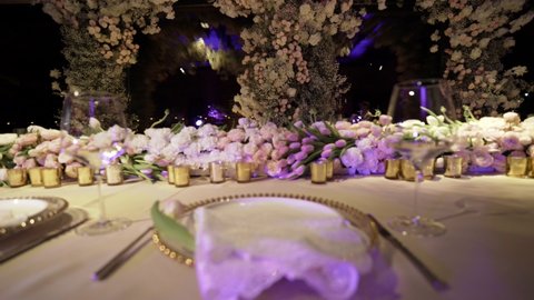 The wedding table decorated with beautiful flowers 