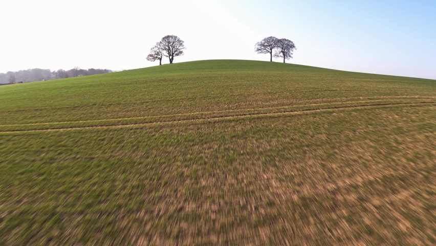 Trees on hill in spring first person view  freestyle