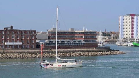 Portsmouth, Hampshire, UK, March 25, 2022. Our Isles and Oceans 70ft Clipper Racing yacht around the world, leaving Portsmouth Harbour with a full crew onboard.