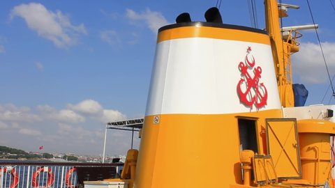 ISTANBUL - CIRCA 2015: Funnel and radar mast of a vintage ferryboat in clear blue sky. Radar control system intended to improve navigation safety along Bosporus straits
