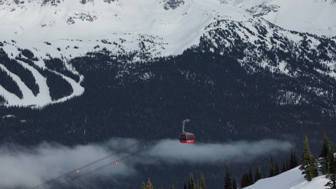 Whistler Mountain Peak2Peak gondola, ski mountain, sunny day, winter, ski hill. 4k 24fps