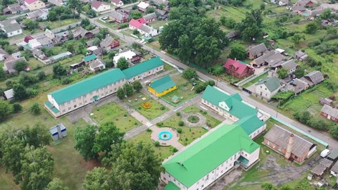 Aerial drone of Klevan town buildings and homes in Rivne Oblast Ukraine. Filmed on a summer day in August 2021
