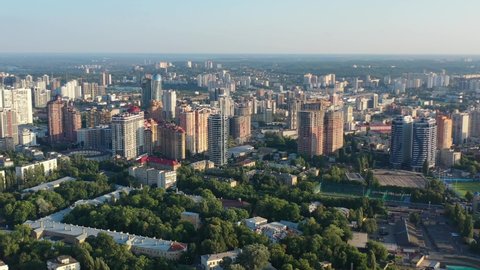 Aerial drone video of downtown apartment buildings in Solomyanskyi District of Kyiv Oblast Ukraine during sunset. Filmed on a summer day in August 2021