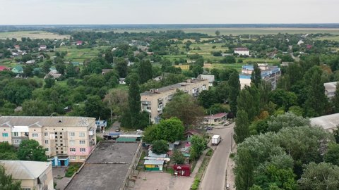 Aerial Drone video of Kalyta town apartment buildings and streets on the border of Kyiv Oblast and Chernihiv Oblast Ukraine. Filmed on a summer day in August 2021