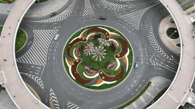 Drone aerial view of Landmark roundabout road in Shanghai downtown. Travel, transportation and business concept b-roll footage. Busy cross road with flower decorations. 4k city life video footage