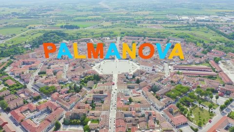 Inscription on video. Palmanova, Udine, Italy. An exemplary fortification project of its time was laid down in 1593. Different colors letters appears behind small squares, Aerial View