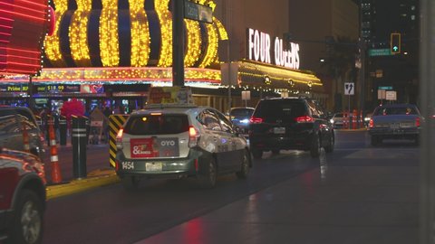 Las Vegas, Nevada - February 4, 2022: Slow traffic at night crossing over Fremont St. 
