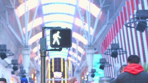 Las Vegas, Nevada - February 4, 2022: A view of a pedestrian walking light with flashing neon lights