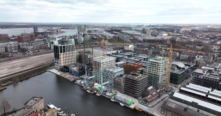 Amsterdam, 6th of March 2022, The Netherlands. Modern apartment constuction site residential housing Oostenburg, city district. Oostelijke Eilanden along the Ij.