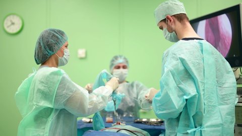 The medical team performs the operation using surgical instruments. Neurosurgeon Endoscopic Surgery