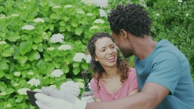 Animation of camera interface over happy biracial couple gardening. gardening and community garden week concept digitally generated video.