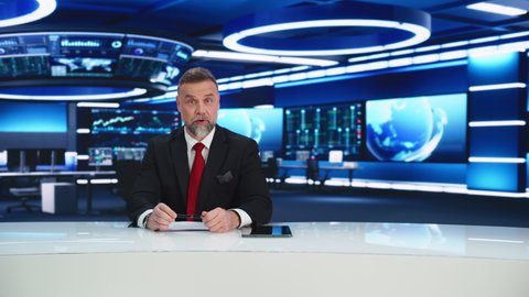 TV Live News Program with Professional Male Presenter Reporting. Television Cable Channel Anchorman or Host Talking about Important Events. Network Broadcast Mock-up Playback. Modern Newsroom Studio