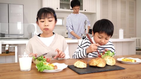 Family Three Japanese Eating Breakfast Stock Footage Video (100%