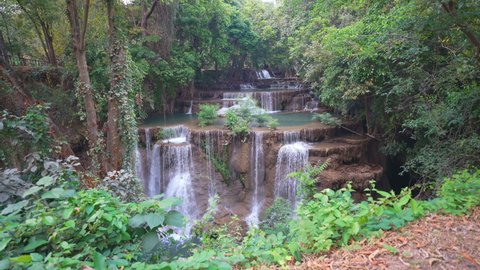 landscape waterfall clear water on summer season for holiday relax on green tree in jungle or natural forest at huai mae khamin waterfall floor 4 in KhuanSrinagarindra national park with nature sound
