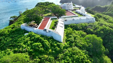 Island of Fernando de Noronha Brazil. Military fort with weapons at volcano mountain at archipelago of Fernando de Noronha Brazil. Tropical islands at Fernando de Noronha national park.
