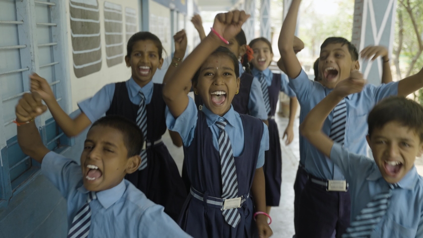 Group of cheerful students shouting by looking camera at school corridor - conept of innocence, freedom and relaxation Royalty-Free Stock Footage #1088674713