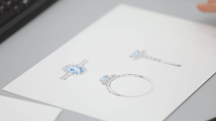 woman designer draws a sketch for jewelry