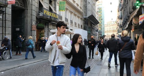 Naples, Italy - March 24, 2022: Via Toledo, in the historic center of the city people walk the street on a spring day, looking for shopping, leisure or tourism.