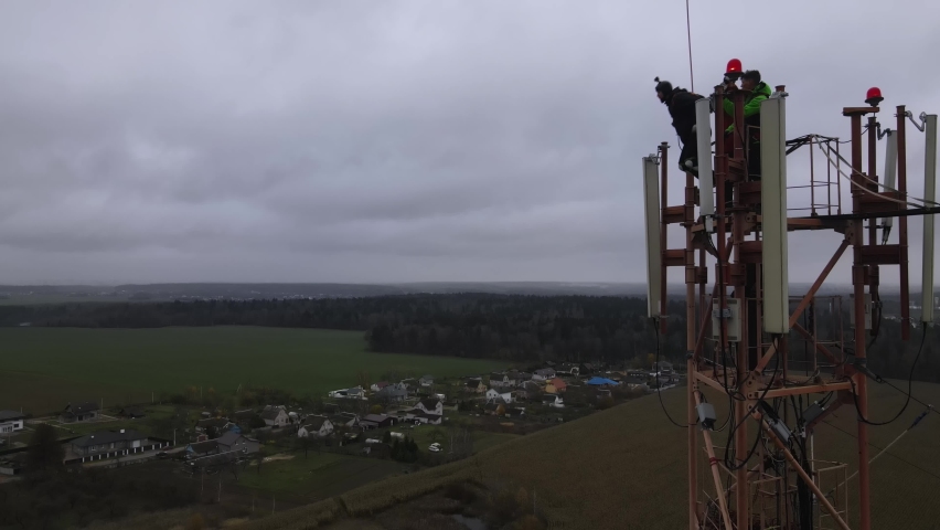 a man jumps from a mountain with a parachute, a jump from a cliff, a free fall, helmet camera