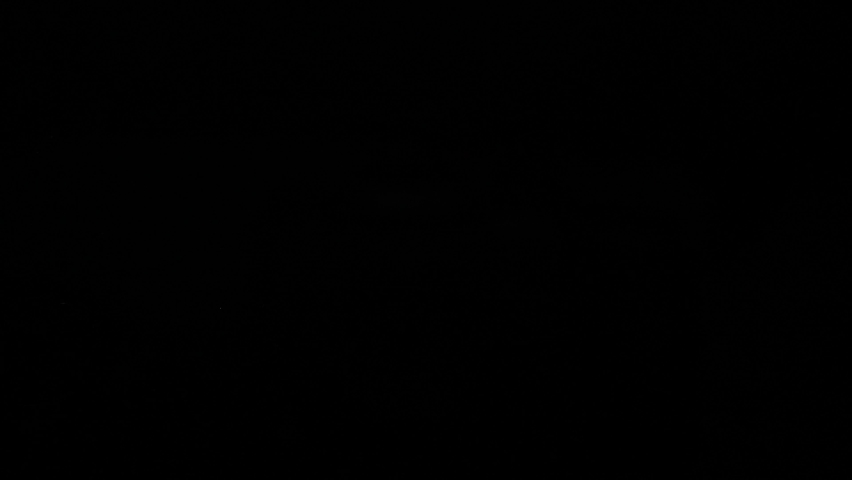 Brush painting blue on black background. High quality 4k footage