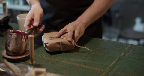 Cropped craftsman pouring sealing wax