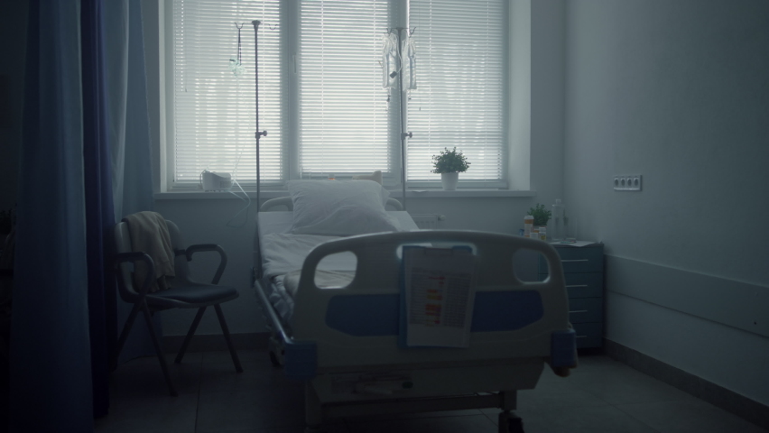 Empty clinic room interior with neat beds medical drips. Calm ward environment. Fully equipped hospital room waiting for iv patient therapy. Contemporary healthcare medical service business concept Royalty-Free Stock Footage #1088683319