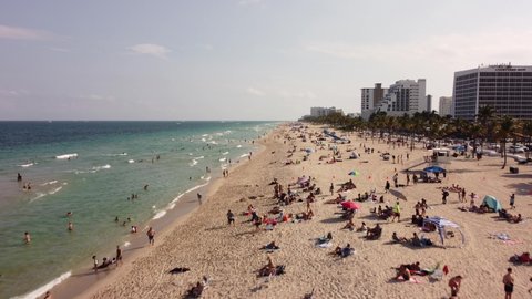 Fort Lauderdale, FL, USA - March 20, 2022: Aerial rising video footage Spring Break 2022 on Fort Lauderdale FL Beach
