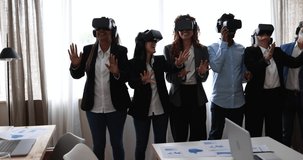 Multiracial teamwork having fun wearing virtual reality headset inside business office
