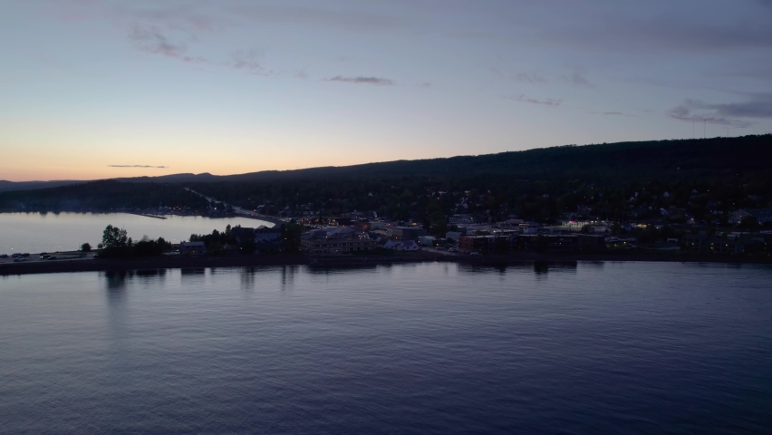 Late evening aerial drone shot of downtown Grand Marais, MN in the summer