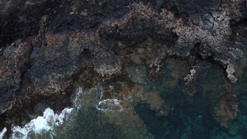 Top down aerial view of the rocky and mountainous coast in Lanzarote, Canary Islands