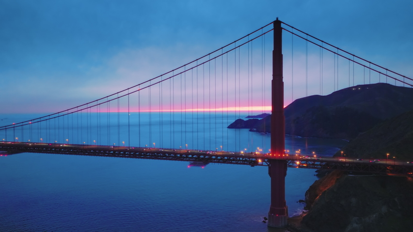 Aerial view of the Golden Gate Bridge in San Francisco bay, California US. Suspension bridge the most iconic landmarks of North America. Red bridge between San Francisco and Marin County. Drone 4K Royalty-Free Stock Footage #1088693099