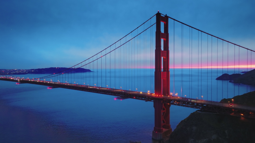 Aerial view of the Golden Gate Bridge in San Francisco bay, California US. Suspension bridge the most iconic landmarks of North America. Red bridge between San Francisco and Marin County. Drone 4K Royalty-Free Stock Footage #1088693099