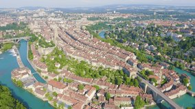 Inscription on video. Bern, Switzerland. Historic city center, general view, Aare river. On the mechanical display, Aerial View