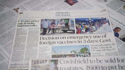 Dehradun, Uttarakhand India-May 05 2021- Newspaper Headlines of Covid-19 or Coronavirus in India. News headline about Rising cases of Coronavirus in India. The third wave of Coronavirus in India
