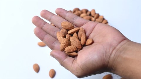 Nut almond close up in bowl. product rich in minerals and vitamins. Almond turns in a shot. Almond kernels rotating. slow motion.