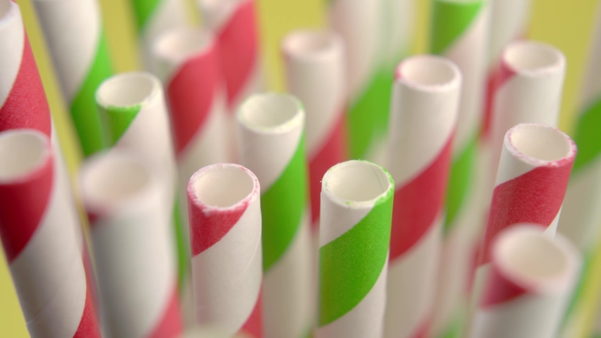 Colored striped bright paper drinking straws close up. Macro. Rotation. Birthday concept Royalty-Free Stock Footage #1088696703