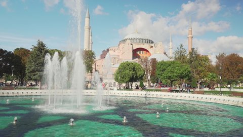 Istanbul, Turkey - September 15, 2021: Scenic fountain at the Sultanahmet Square and the Hagia Sophia in Istanbul, Turkey. The Sultanahmet Square is a popular tourist attraction of the world.