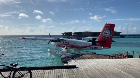 Vommuli, Maldives - November 8 2021: A Twin Otter Turboprop Seaplane from Trans Maldivian Airways departing the St. Regis Maldives Vommuli Resort