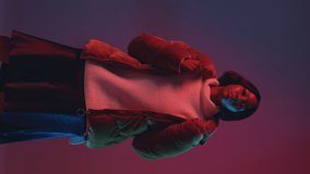 Stylish african american girl blogger clap, changing clothes, recording vertical video for social networks. ProRes codec - Powered by Shutterstock - Get 15% off with code: PIKWIZARD15