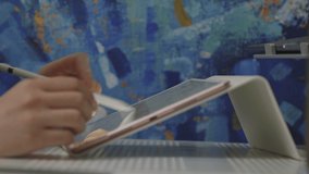 Young woman, graphic designer works remotely, sitting couch home. Draws graphics tablet stylus, logo, UI design website, smartphone application, graphic image, remote freelance exchange, NFT product - Powered by Shutterstock - Get 15% off with code: PIKWIZARD15