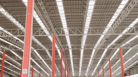 large steel structure roof of factory. steel structure of  cargo or warehouse. steel fabrication. tilt up camera.