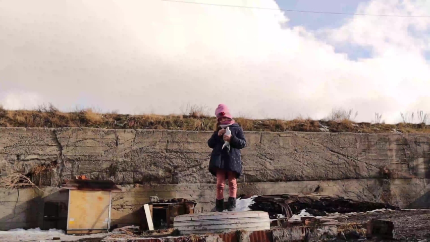 Little pigeon fancier. girl playing outdoor in winter scenery with flying pigeons.
Freedom, peace, harmony, release, kindness concept.
dove bird fly from hands in park outdoor releasing letting go
