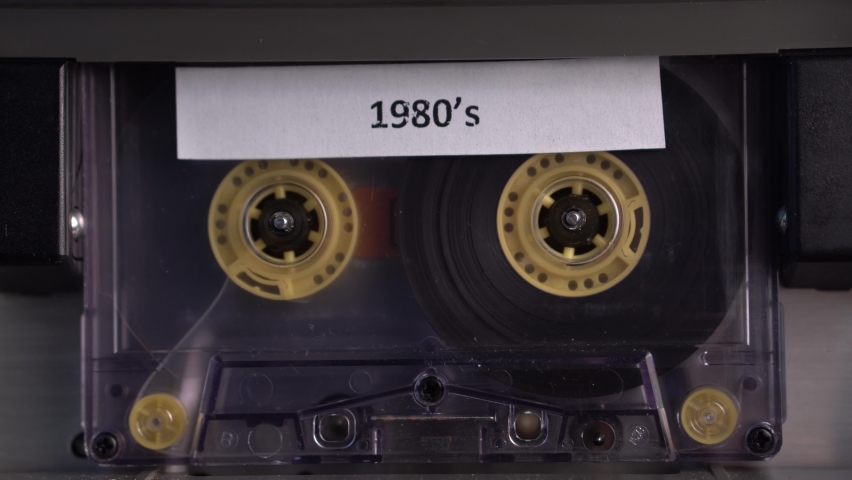 The End of 1980's Audio Cassette Tape Rolling in Vintage Deck Player, Close Up
