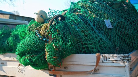 Pile of Tangled Up Professional Nylon Fishing Net with Buoys and Markers