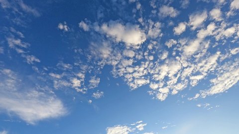 Beautiful sunny navy blue sky background n white cirrocumulus cloud or cumulus cloudscape in tropical summer or spring sunlight n sun ray at daylight sunshine day, 4k cinemagraph b-roll TimeLapse